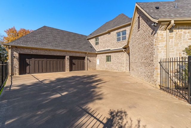 view of side of property featuring a garage