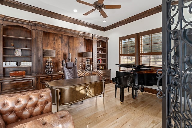 office space featuring ceiling fan, light wood-type flooring, and ornamental molding