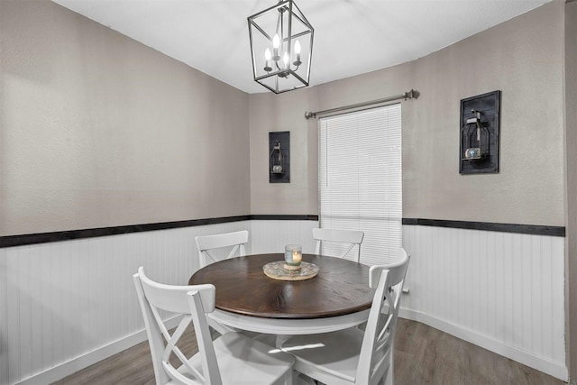 dining area with a chandelier and hardwood / wood-style floors