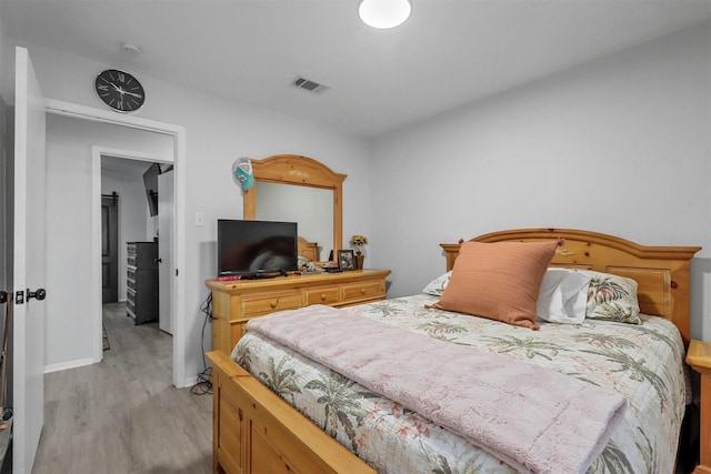 bedroom with light hardwood / wood-style flooring