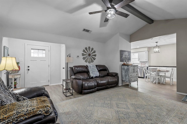 living room featuring light hardwood / wood-style flooring, vaulted ceiling with beams, and ceiling fan with notable chandelier