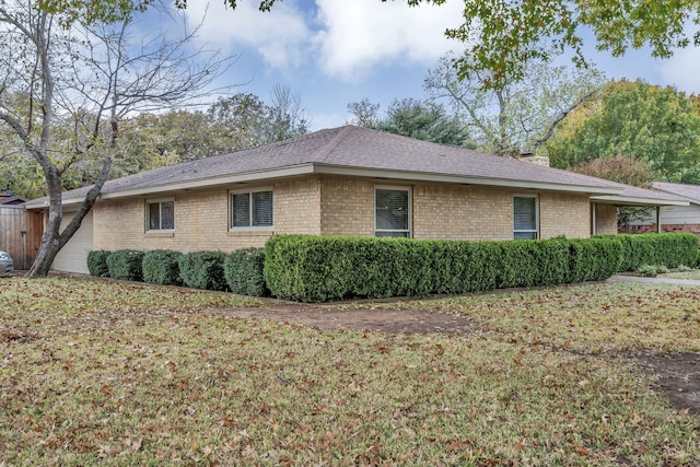 view of property exterior with a lawn