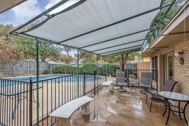 view of swimming pool with a patio area