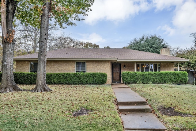 ranch-style home featuring a front yard