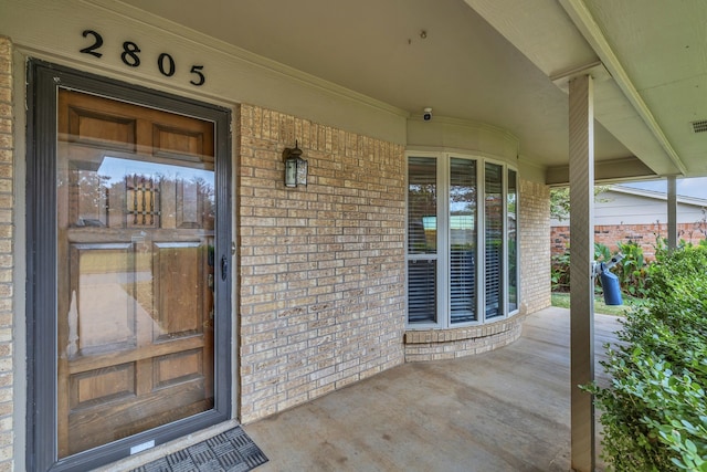 doorway to property with a porch