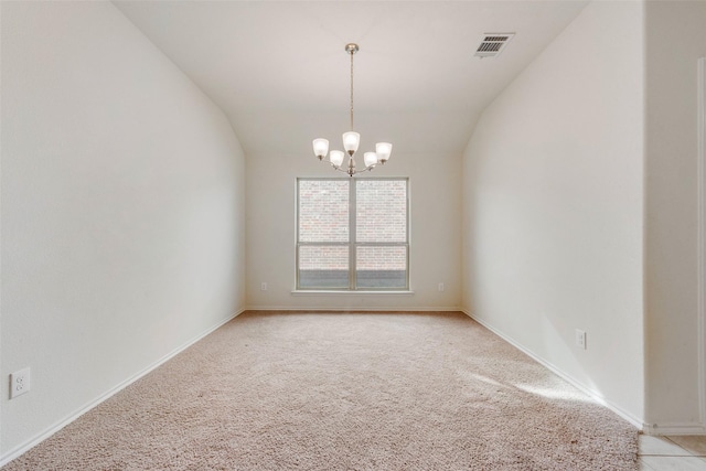 spare room with lofted ceiling, a chandelier, and light carpet