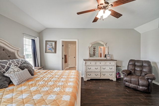 bedroom featuring dark hardwood / wood-style flooring, vaulted ceiling, and ceiling fan