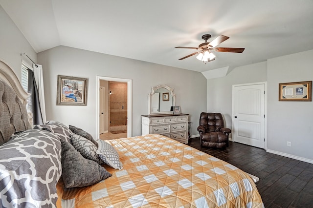 bedroom featuring lofted ceiling, dark hardwood / wood-style floors, ceiling fan, and ensuite bathroom