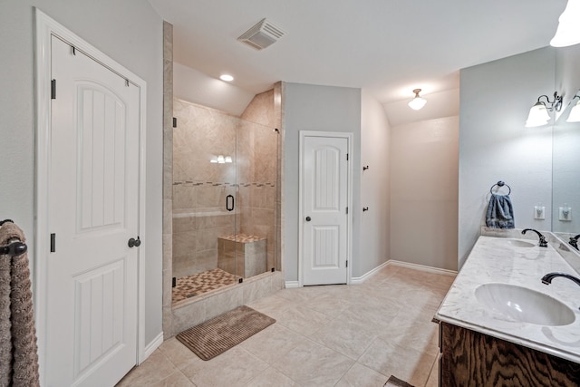 bathroom featuring vanity, tile patterned flooring, a shower with door, and lofted ceiling