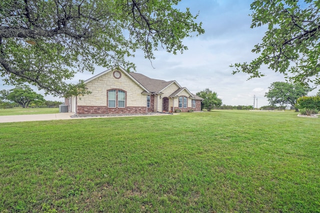 single story home featuring a front lawn