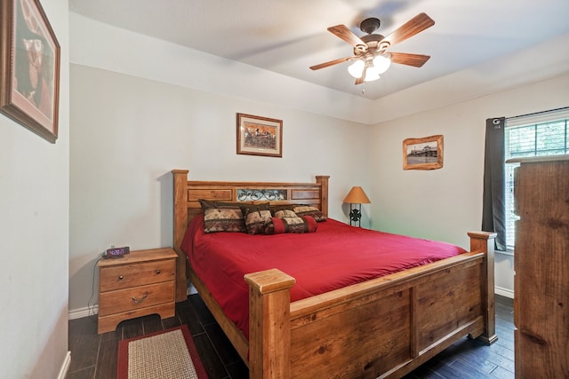 bedroom featuring ceiling fan and dark hardwood / wood-style floors