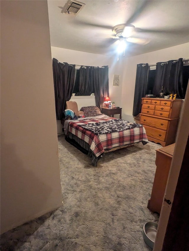 bedroom with ceiling fan and carpet floors