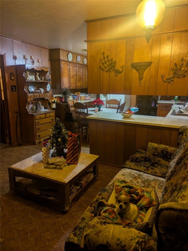 living room with dark tile patterned floors