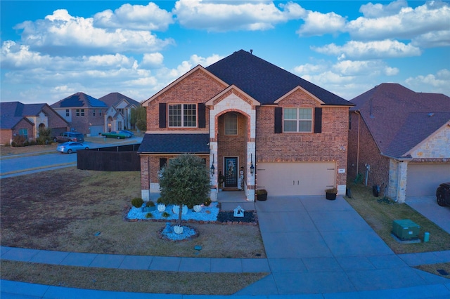 view of front facade with a garage and a front lawn