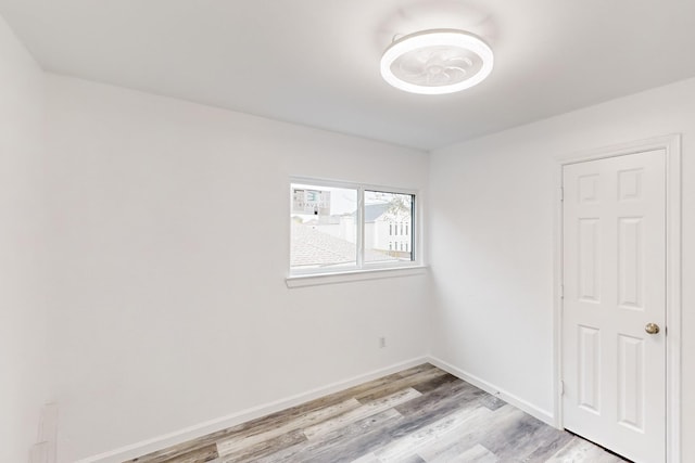 spare room with light wood-type flooring