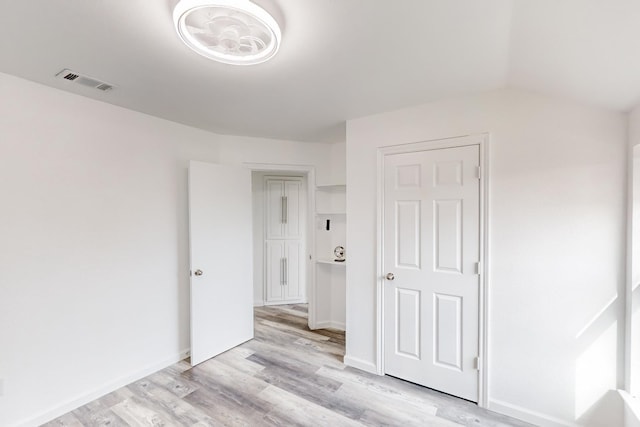 empty room with light hardwood / wood-style floors