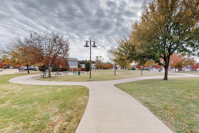 view of home's community with a lawn