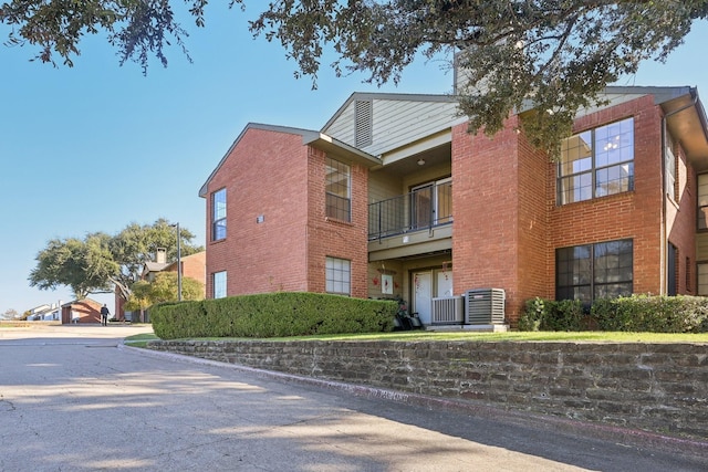 view of building exterior with central AC