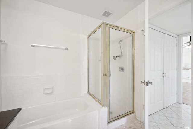 bathroom with tile patterned flooring, ceiling fan, and independent shower and bath