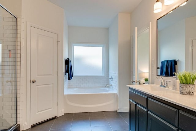 bathroom with tile patterned flooring, vanity, and independent shower and bath