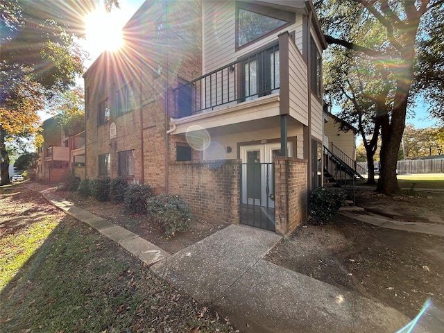 view of side of home with french doors