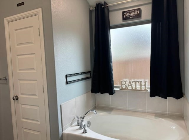 bathroom featuring a tub