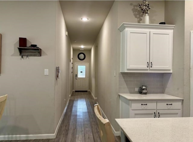 hall with dark wood-type flooring