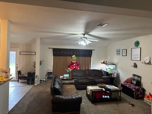 tiled living room featuring ceiling fan