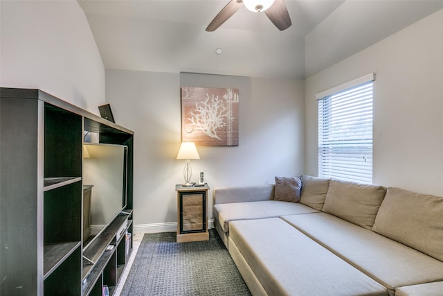 living room featuring vaulted ceiling and ceiling fan