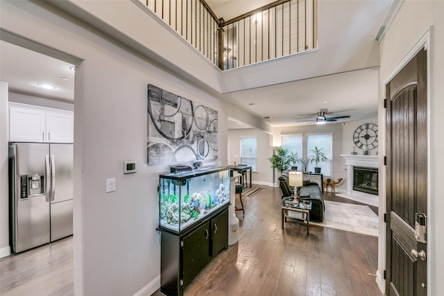 interior space with hardwood / wood-style floors and ceiling fan