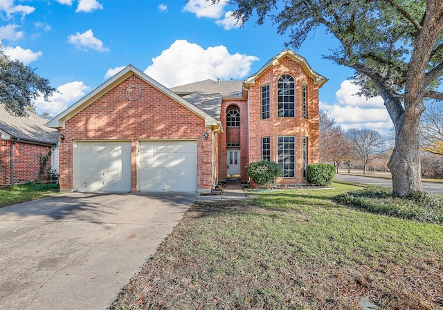 front facade featuring a front yard and a garage