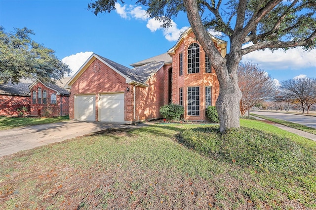 view of front of home featuring a front lawn and a garage