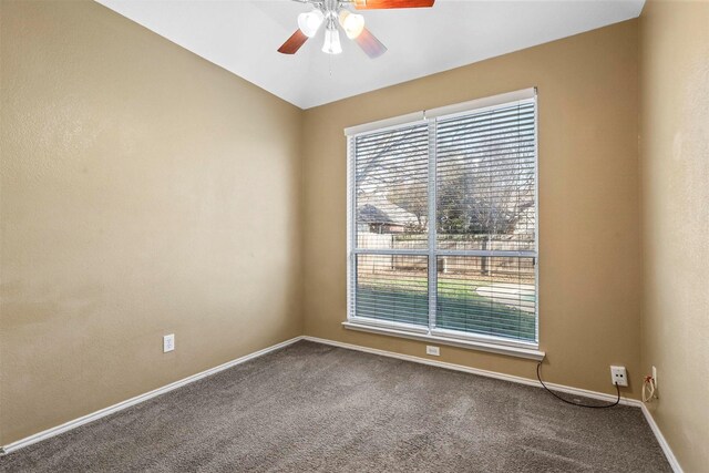 carpeted empty room with plenty of natural light and ceiling fan