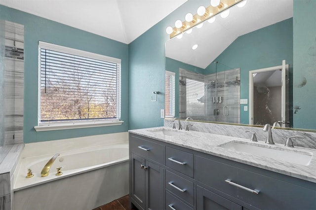 bathroom with vanity, hardwood / wood-style floors, plus walk in shower, and lofted ceiling