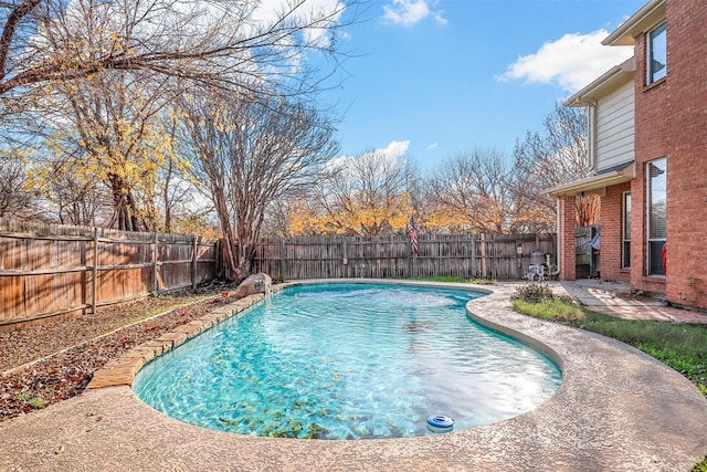 view of swimming pool with pool water feature