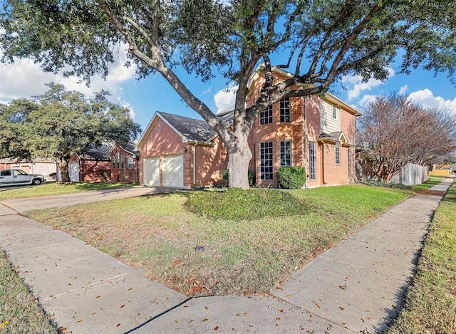 view of front of home featuring a front lawn and a garage