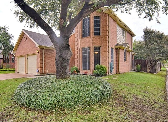 view of front facade with a front yard and a garage