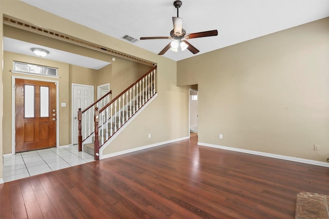 foyer entrance featuring ceiling fan and light wood-type flooring