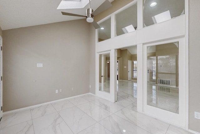 spare room featuring french doors, high vaulted ceiling, and ceiling fan