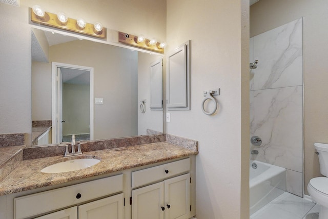 full bathroom with vanity, toilet, and tiled shower / bath combo