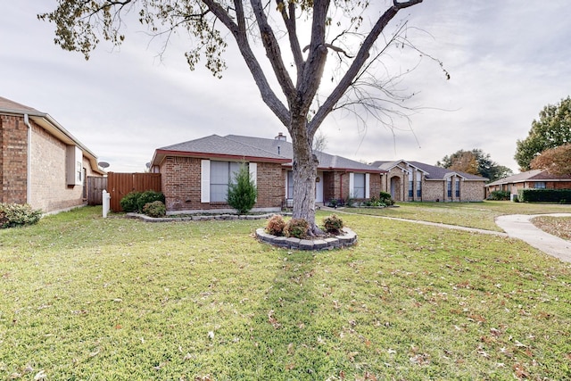 ranch-style house with a front lawn