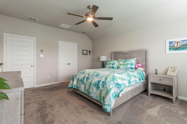 carpeted bedroom featuring ceiling fan, a closet, and vaulted ceiling