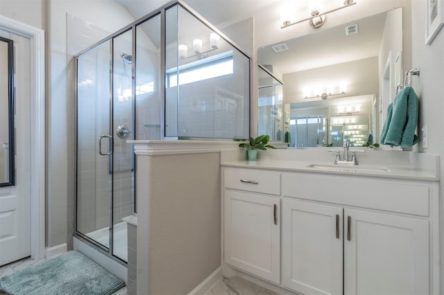 bathroom with vanity and an enclosed shower