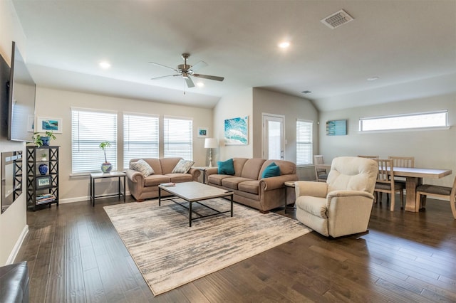 living room with ceiling fan, a healthy amount of sunlight, dark hardwood / wood-style flooring, and vaulted ceiling