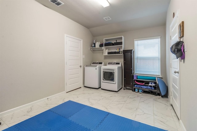 clothes washing area with independent washer and dryer