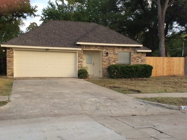 ranch-style home with a garage