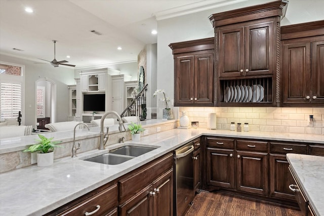 kitchen with dark brown cabinets, crown molding, sink, dishwasher, and dark hardwood / wood-style floors