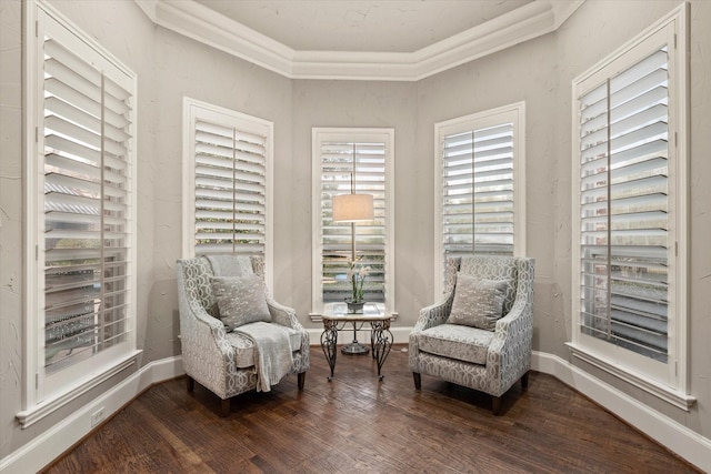 sitting room featuring crown molding and hardwood / wood-style flooring