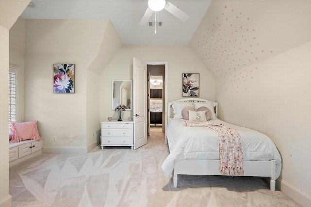 carpeted bedroom with ceiling fan and lofted ceiling