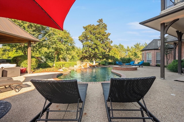 view of swimming pool with a patio